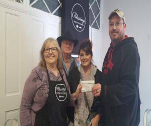 Pictured: Gerald Eaton (Brass General Foreman, Clow Valve) and his wife Amanda presenting donation to Blessings Soup Kitchen